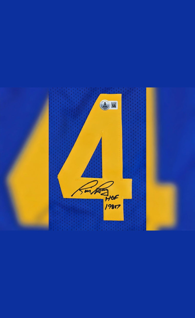 فانيلة موقعة من ريك باري ومكتوب عليها "HOF 1987 Beckett Certified Scoring Legend"